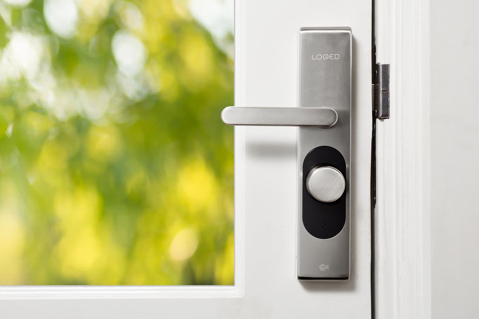 Modern lock hardware fitted to a white door