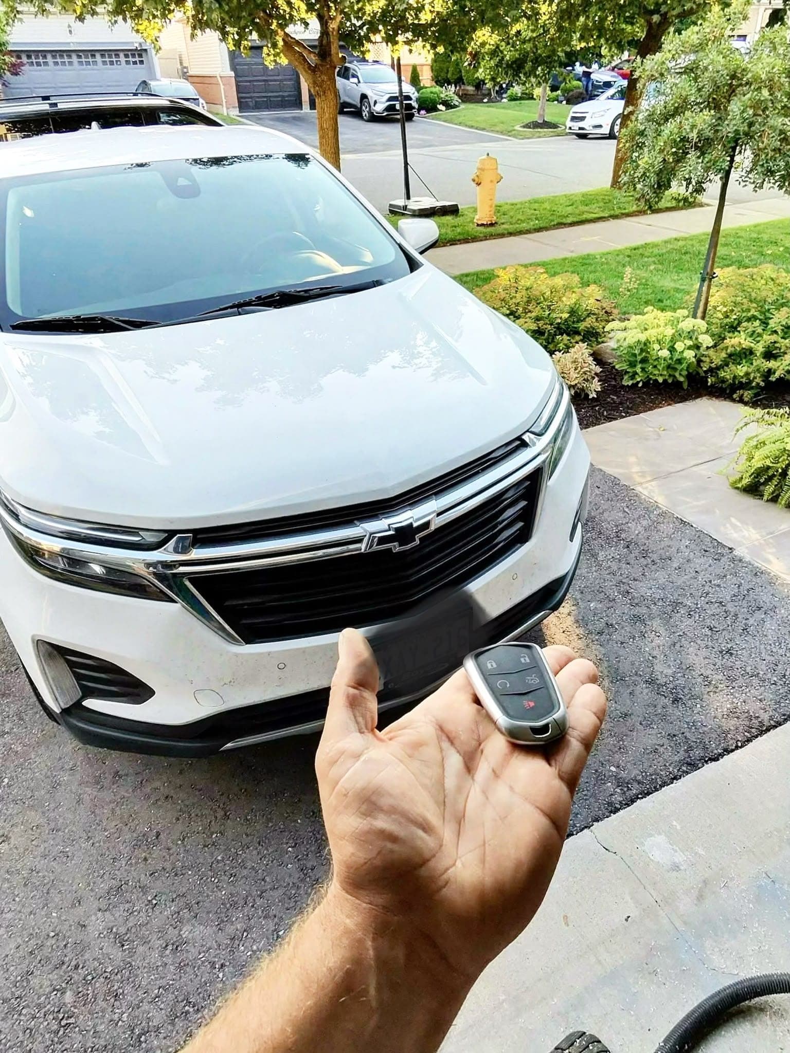 2023 Chevrolet Equinox in the driveway with the newly programmed key